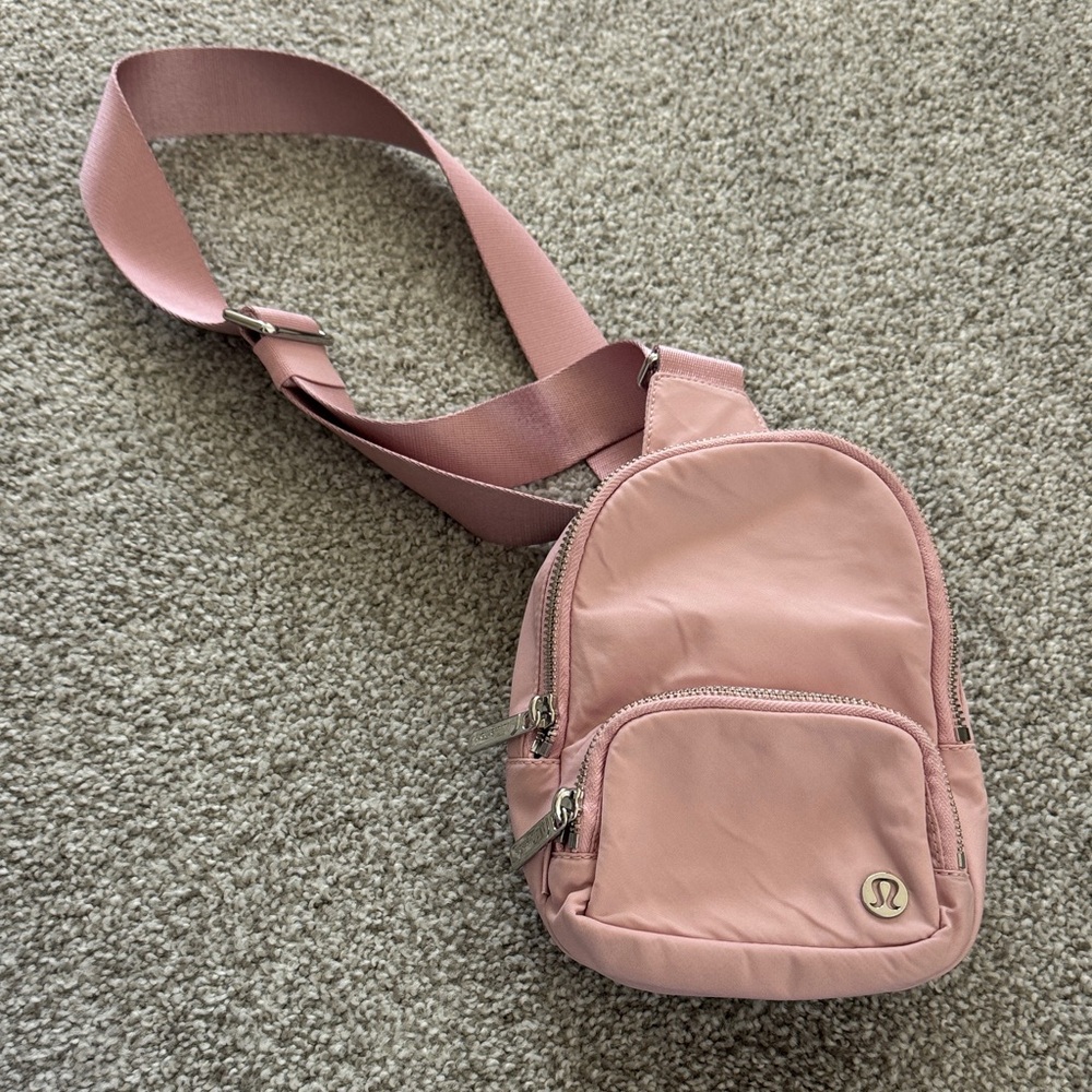 Lululemon pink mini backpack cross body bag